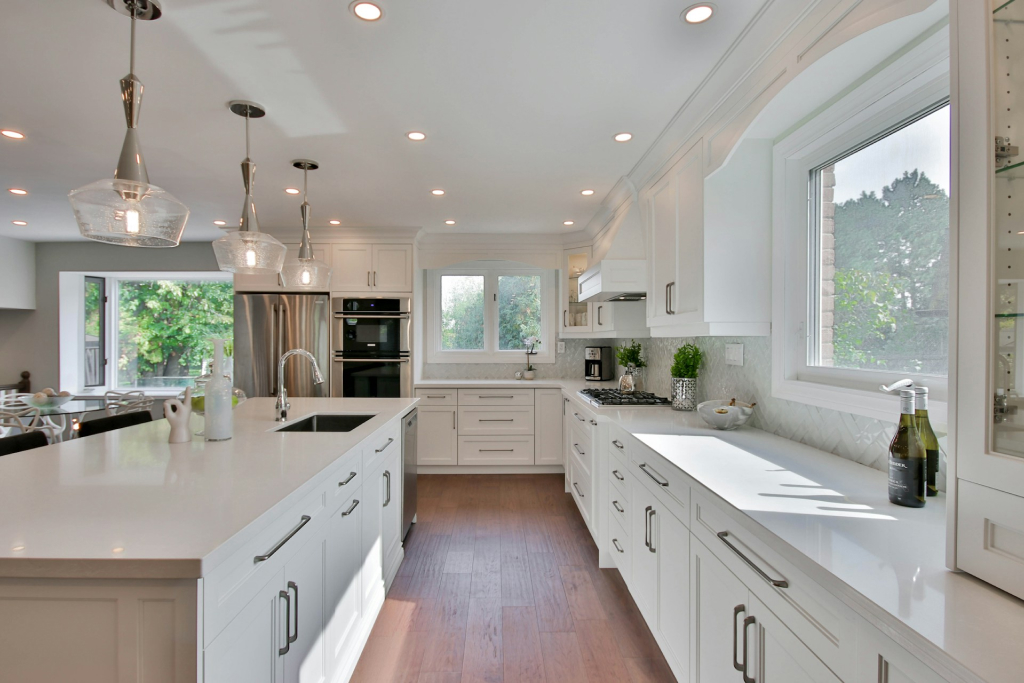 a white kitchen with cabinets