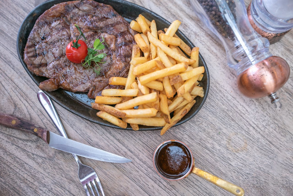 a plate of steak and fries, the four best restaurants in tracy california