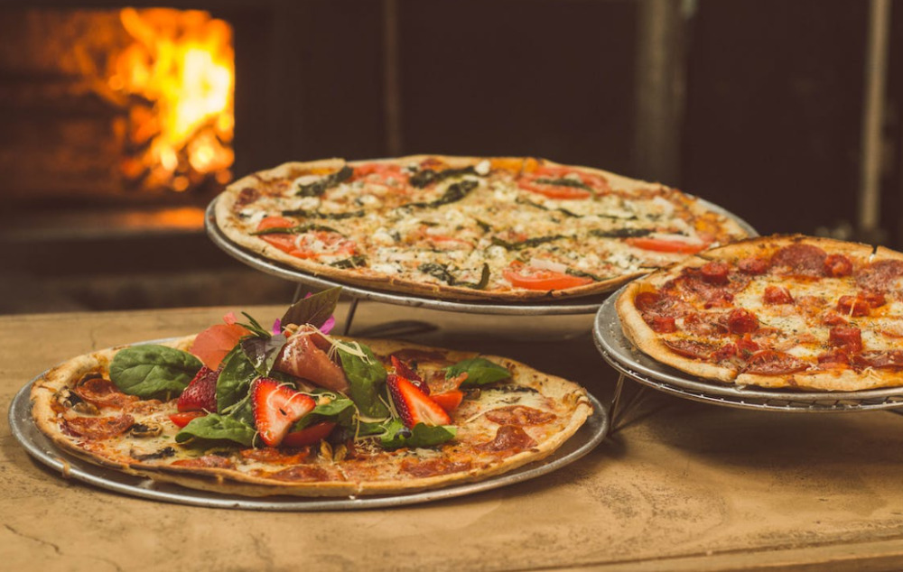 three plates of pizza, the four best restaurants in tracy california
