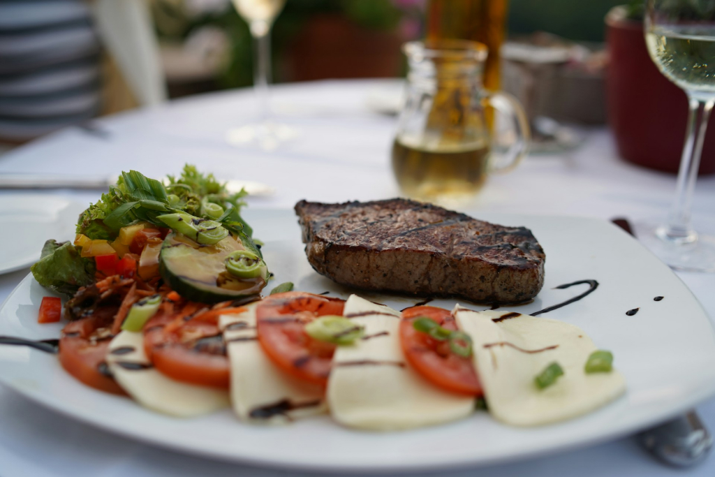 steak served with mozarella tomatoe and vegetables in the best restaurants in mountain house